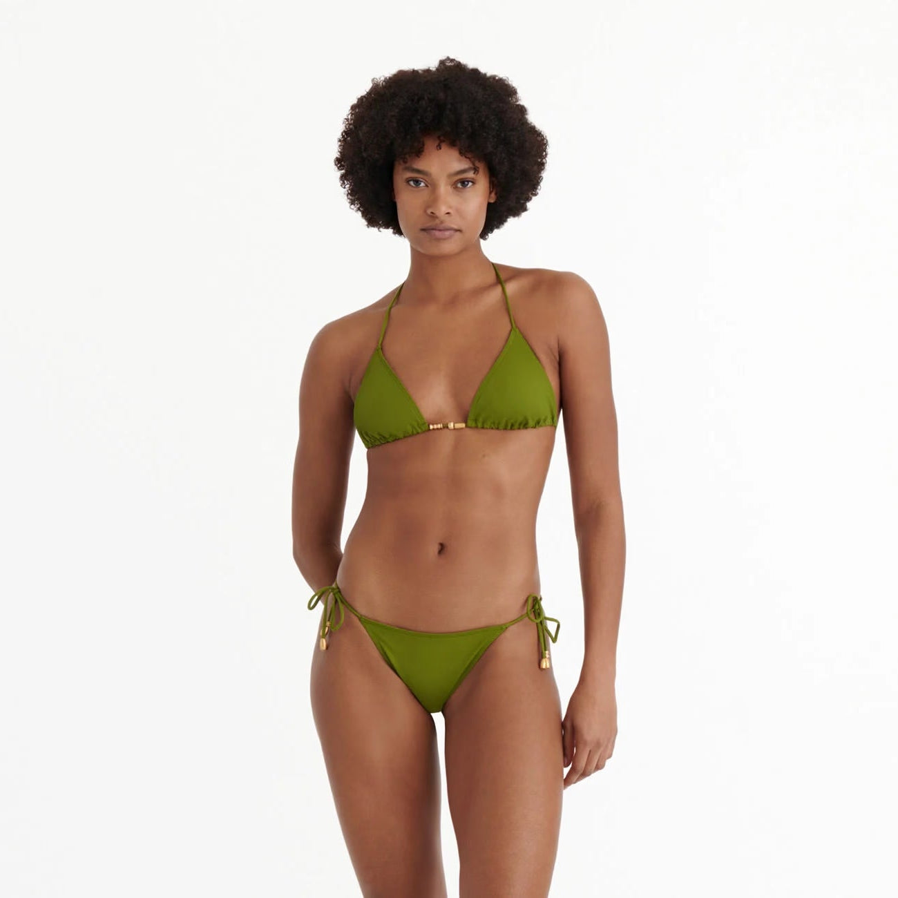Woman wearing a green bikini on a white background available at LaSource in New Canaan, Darien and Westport, CT