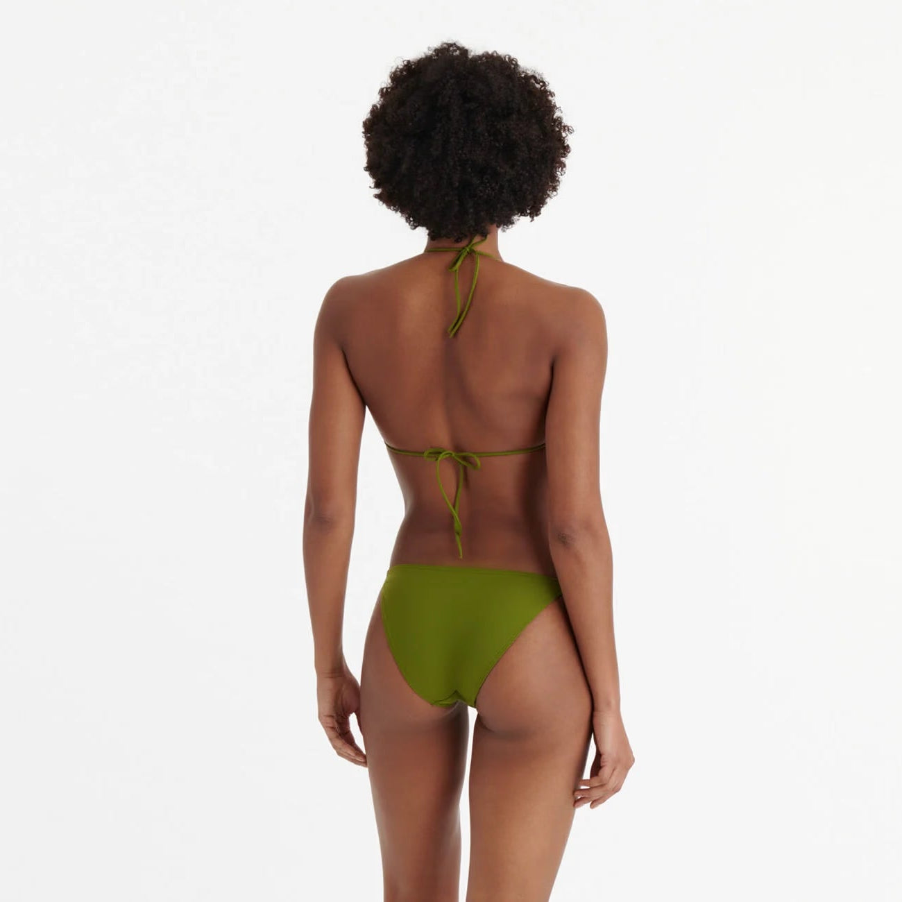 Person wearing a green bikini on a white background available at LaSource in New Canaan, Darien and Westport, CT