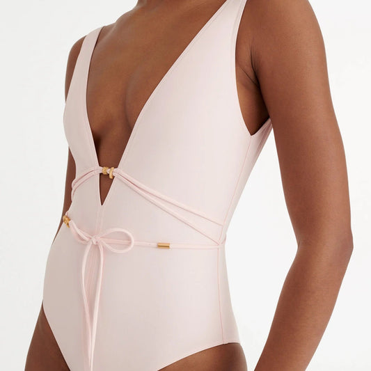 White swimsuit with thin straps on a white background  available at LaSource in Darien, New Canaan and Westport