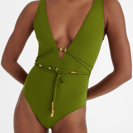 Green swimsuit with a plunging neckline on a white background available at LaSource