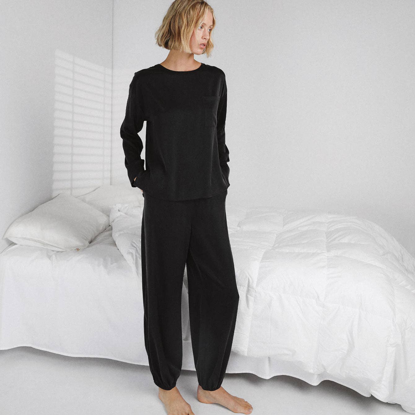 Lunya- Washable Silk Long Sleeve Jogger Pant Set in black, available at LaSource in Darien.