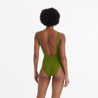 Person wearing a green  swimsuit available at LaSource
