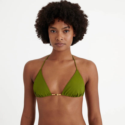 Woman wearing a green bikini top against a white background available at  LaSource in New Canaan, Darien and Westport, CT