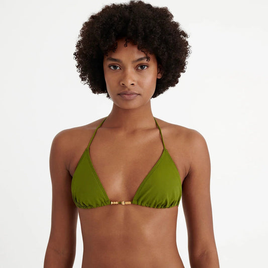 Woman wearing a green bikini top against a white background available at  LaSource in New Canaan, Darien and Westport, CT